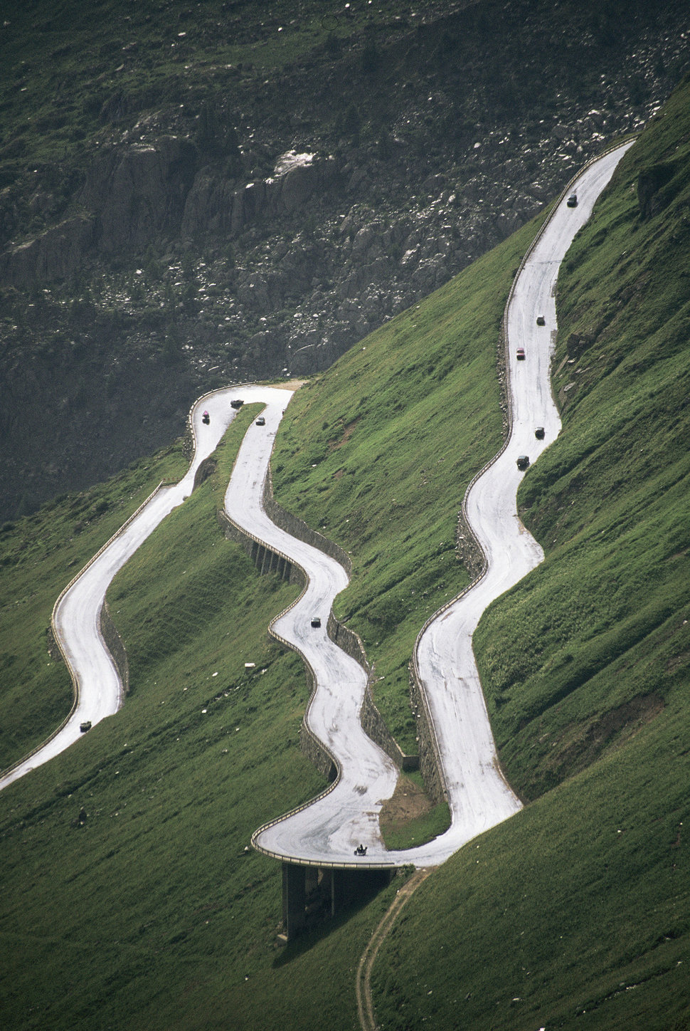 Furka Pass el. 2436 m.) is a high mountain pass in the Swiss Alps connecting Gletsch, Valais with Realp, Uri. There is a road with sharp hairpin bends.