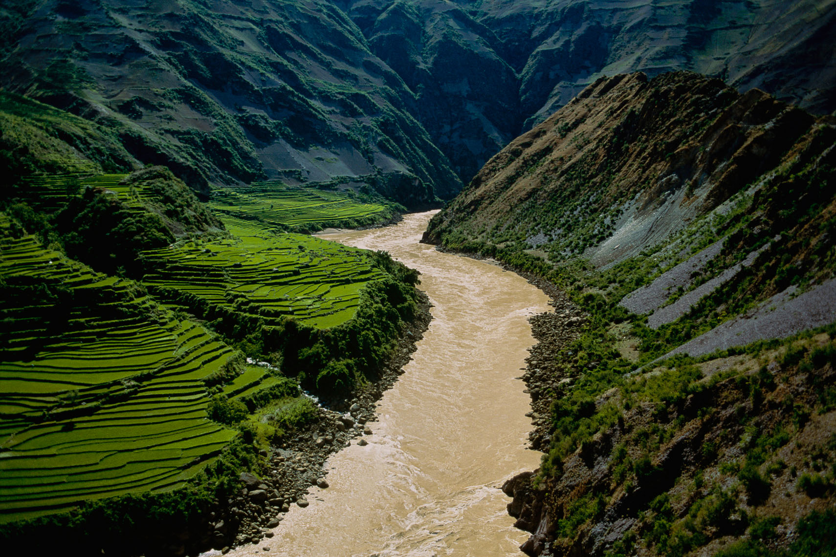 The inhospitable gorges carved by the Mekong near Lanping, in northern Yunna, keep the river unused and unnavigable until its final 90-mile stretch through China, as it spills into Laos.