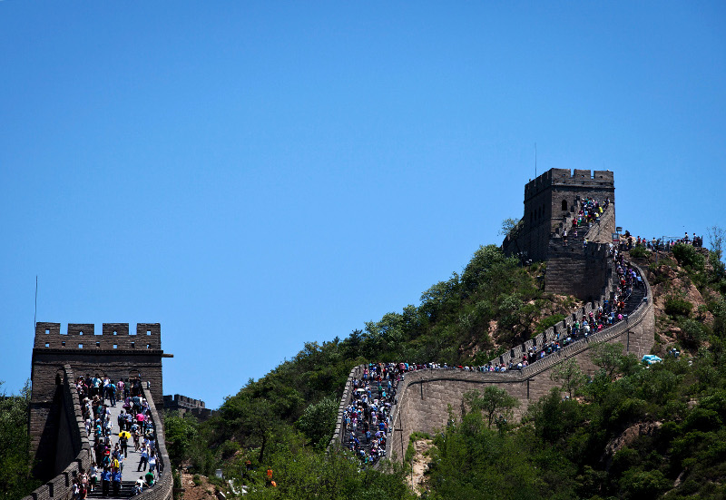 Tourists climb and sightseeing on the Great Wall of China during a weekend holiday at Badaling, north of Beijing Saturday, June 2, 2012. (AP Photo/Andy Wong)