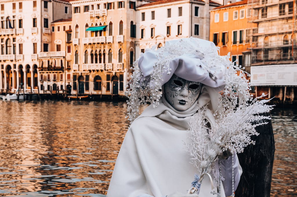 A Person Wearing White Masquerade Mask