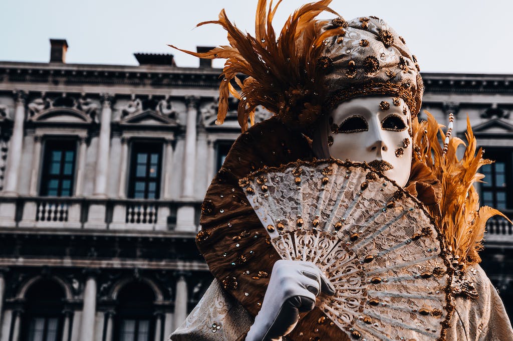 Person Wearing A Mask and Costume At Venice Carnival